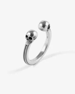 ANELLO BACKBONE IN ARGENTO CON TESCHI