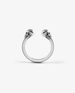 ANELLO BACKBONE IN ARGENTO CON TESCHI