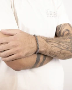 BRACCIALE CORDA CON ELEMENTI TONDI PUNTINATI IN ARGENTO