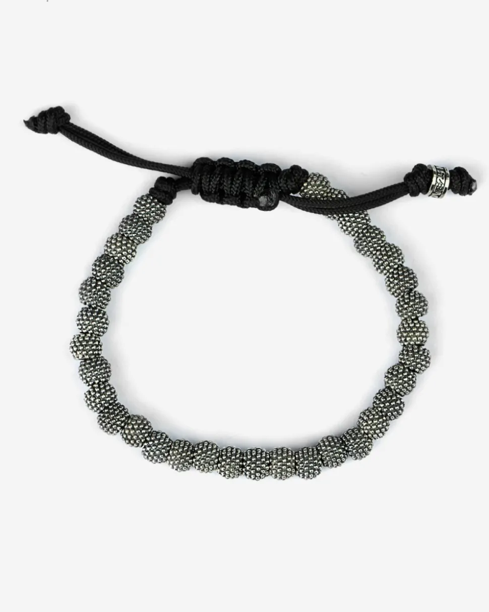 BRACCIALE CORDA CON ELEMENTI TONDI PUNTINATI IN ARGENTO